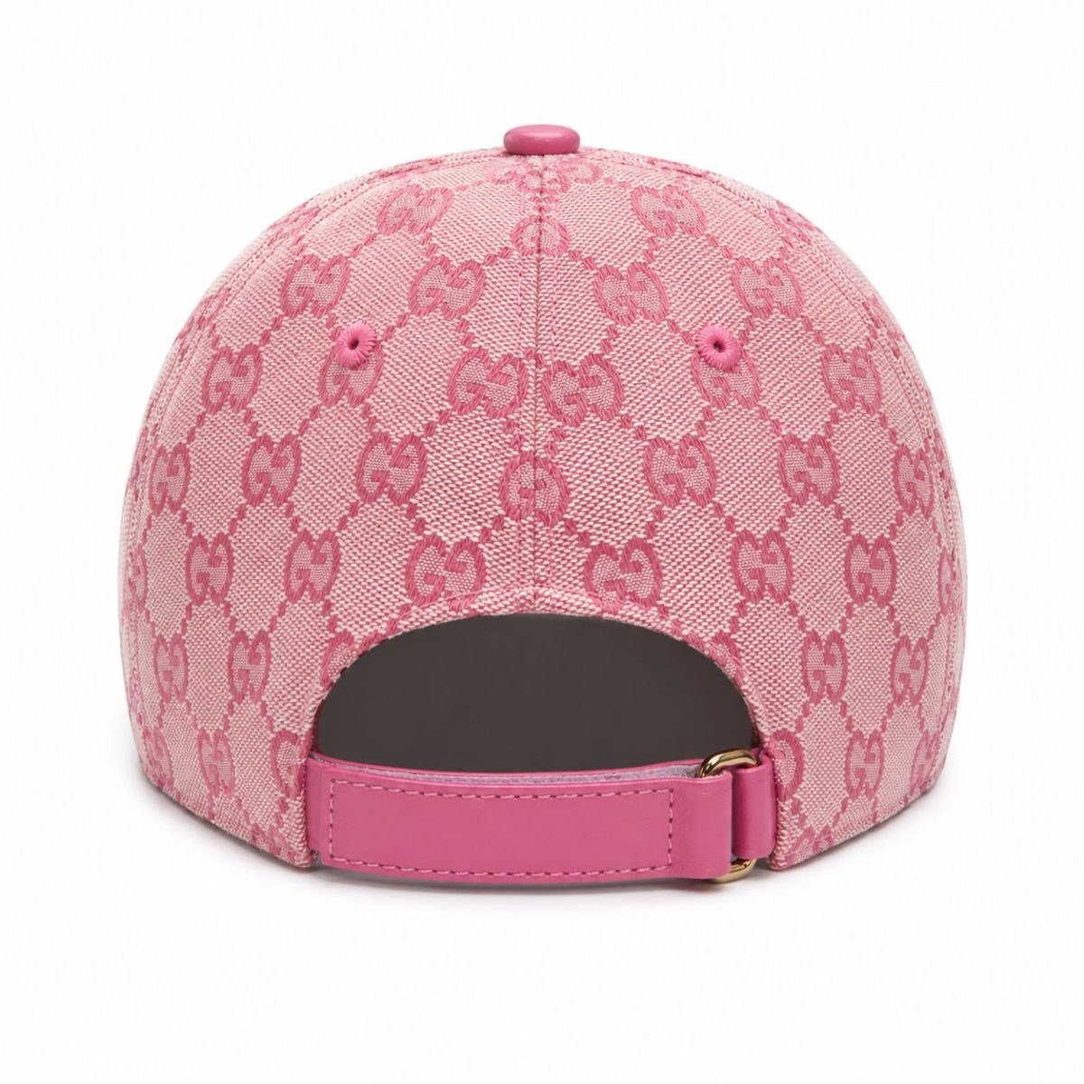 Pink baseball cap with Gucci monogram pattern, back view showing an adjustable pink strap and buckle.