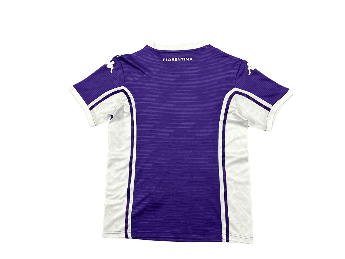 Back view of a purple Fiorentina football jersey with white trim and 'FIORENTINA' text at the neck area.