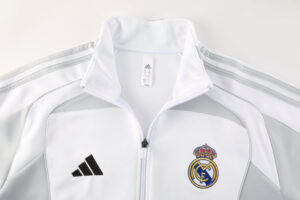 White Real Madrid track jacket with crest on left chest and Adidas logo on right, zipper front.