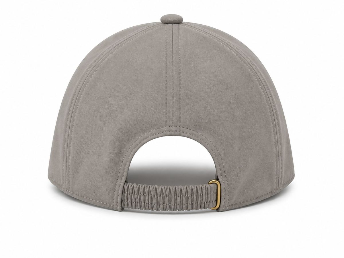 Back view of a gray cap with vertical stitching and an elastic adjustable strap with a small gold buckle.