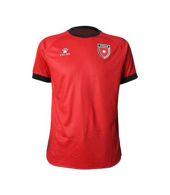 Red short-sleeve soccer jersey with black collar and cuffs, Jordan crest on the left chest and Kelme logo on the right-to-left side.