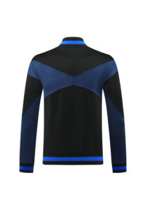 6936214d | UAE SPORT STORE Back view of a black and blue color-block athletic jacket with a blue chevron across the upper back, blue collar stripe, and blue cuffs.