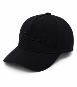 Black baseball cap with Balmain logo embroidered in black on the front.