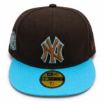Black baseball cap with a teal-brim and brown NY logo outline on the front, side patch visible on the left.