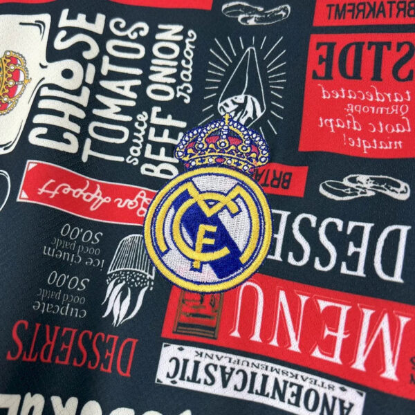 Close-up of a fabric pattern featuring the Real Madrid crest surrounded by various red and white banners and logos.