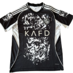 Black athletic jersey with white graphic design and shoulder stripes; large 'KAFD' text across the chest and a circular crest on the upper left.