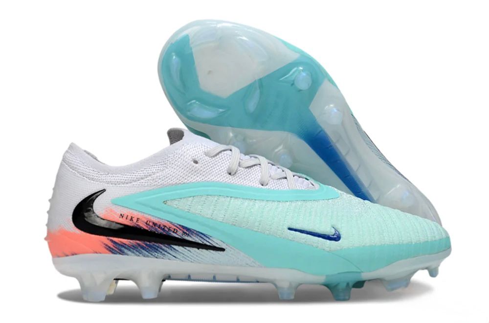 6ab0b73a-88d9-4b6d-a847-de8c0cc30723 Nike soccer cleats in white and mint with a blue swoosh and translucent outsole