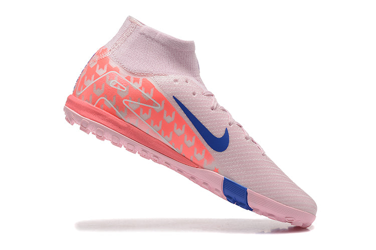 6abba0ee | UAE SPORT STORE Pink high-top athletic shoe with blue Nike swoosh and patterned heel, isolated on white surface.