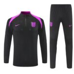 England national football team training set: black long-sleeve top with pink shoulder panels, crest on left chest and pink Nike swoosh; matching black pants with crest and swoosh.