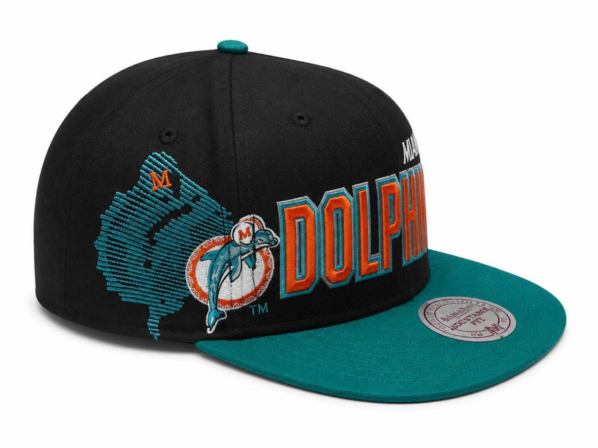 Black snapback cap with teal brim featuring the Miami Dolphins logo and orange 'DOLPHINS' lettering.