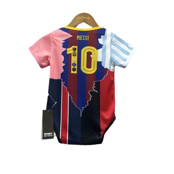 Colorful soccer jersey on a wooden hanger with 'Messi' and number 10, featuring pink left sleeve, blue and maroon vertical panels, and light blue right sleeve.