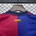 Close-up of a color-block red and blue shirt on a brown hanger against a chain-link fence behind.