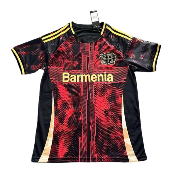 Red and black athletic jersey with yellow trim and a crest on the left chest, featuring bold gold text across the front.