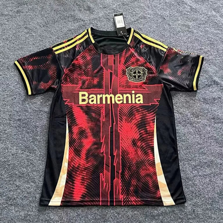 Red and black Borussia-style soccer jersey laid flat, with yellow accents and the word 'Barmenia' across the chest.