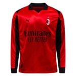 Red AC Milan jersey with black sleeves, crest on the left chest, and Emirates sponsor text across front with a gold star above the badge.