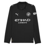 Black Manchester City football jersey featuring sponsor logos (Etihad Airways) and Puma crest on chest.