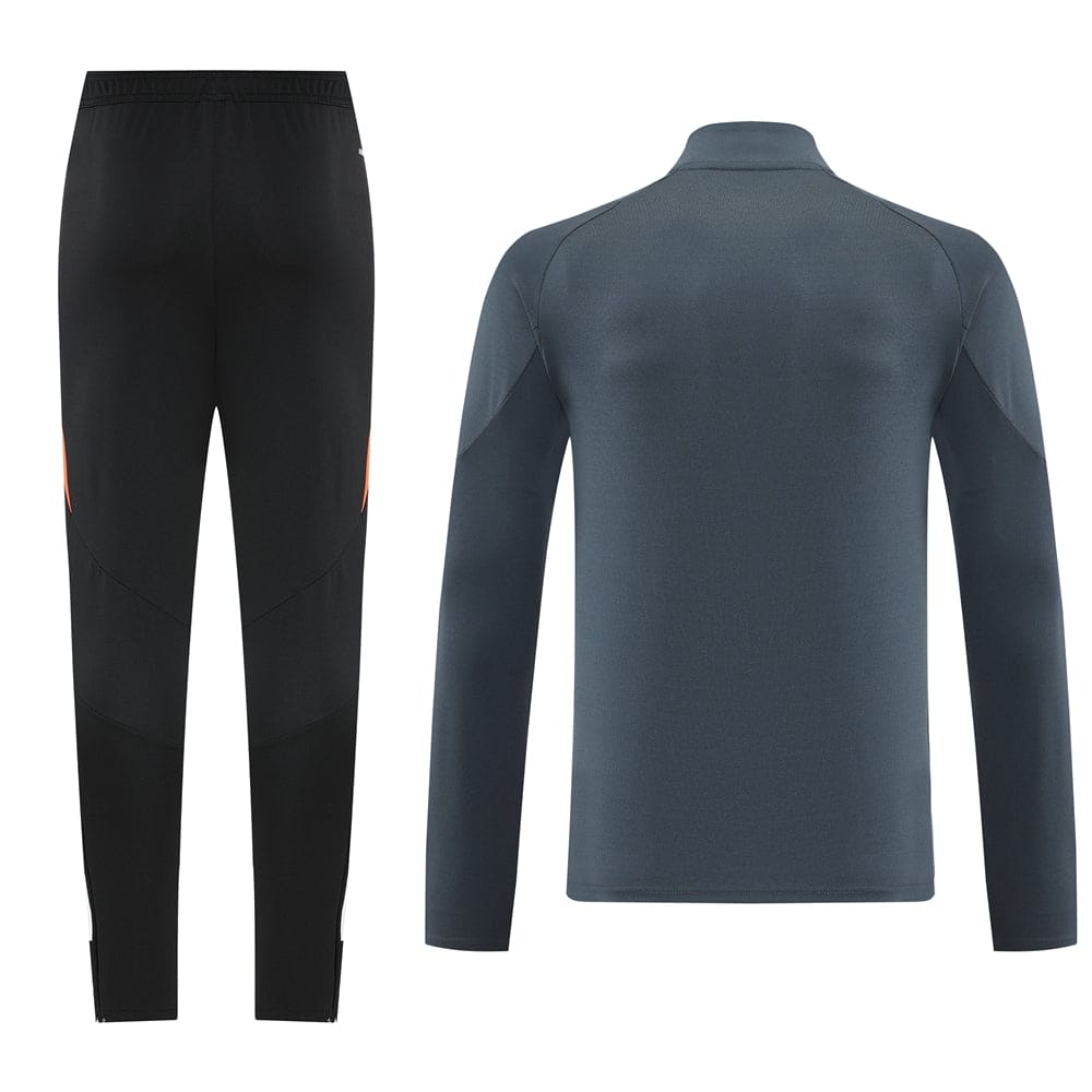 704e00be | UAE SPORT STORE Black athletic pants with orange accent panels pictured next to a blue long-sleeve athletic jacket shown from the back.