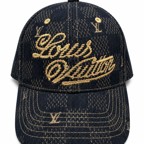 Dark denim baseball cap with gold embroidery reading Louis Vuitton on the front panel and brim stitching in gold thread