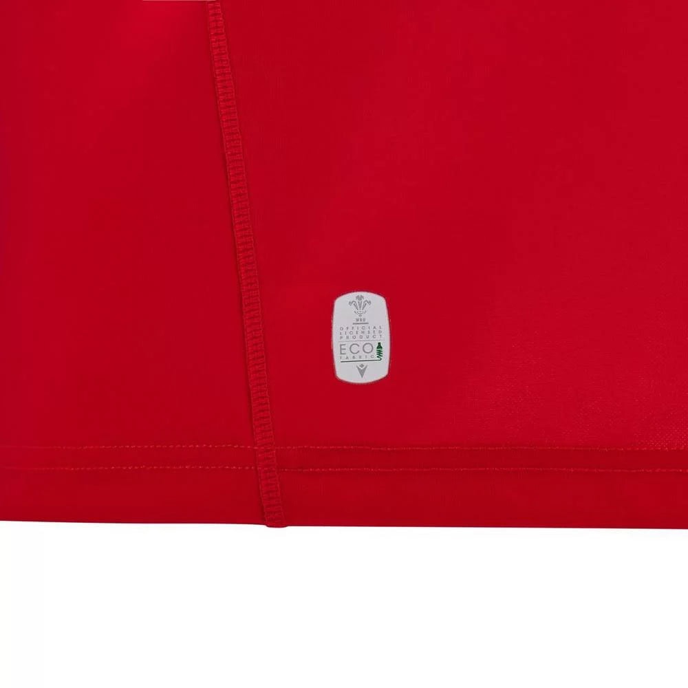 71067fe5d75c687eed11ff95c93ac156 | UAE SPORT STORE Red fabric with a vertical seam and a small white eco-label patch near the bottom hem, indicating eco-friendly material.