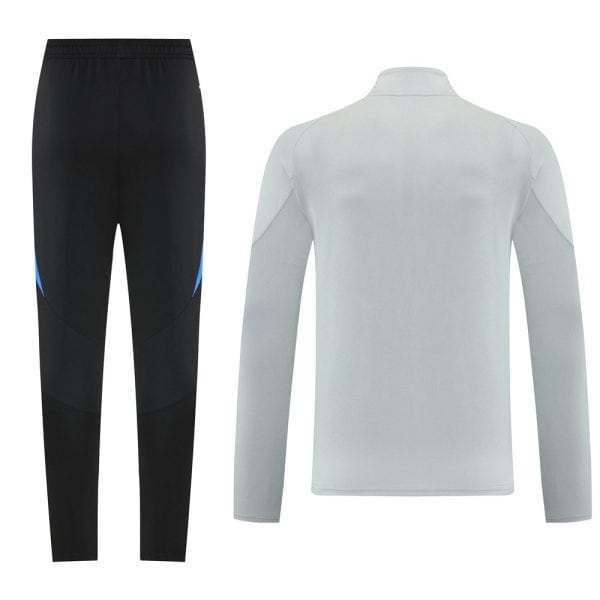 Sportswear set: black athletic pants with blue accents paired with a light gray long-sleeve top, shown from behind