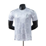 Light gray Real Madrid football jersey with Louis Vuitton monogram pattern on a display mannequin