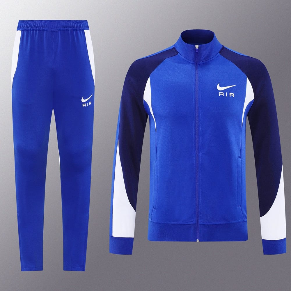 7393b40e | UAE SPORT STORE Blue Nike Air tracksuit set with white side panels; zip-up jacket and matching pants.