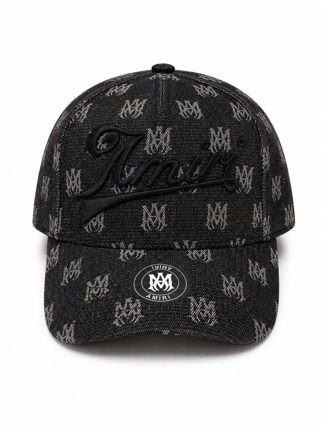 74f71b4a-7941-4ea3-b0be-c697f33f7a52 | UAE SPORT STORE Black denim baseball cap with a repeated light logo pattern and a large embroidered cursive 'Amiri' on the front; round metal sticker on the brim.