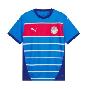 75092e3b-dcdc-4e3b-a383-b28deb35a023 | UAE SPORT STORE Blue soccer jersey with white horizontal stripes and a red chest band, featuring a circular federation crest on the left chest and Puma logos.