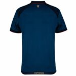 Back view of a blue short-sleeve jersey with dark shoulder panels and red trim, Centenario at the hem.