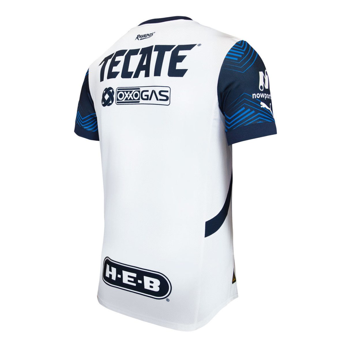 White athletic jersey viewed from the back with bold 'TEcate' logo and blue patterned sleeves, featuring sponsor logos near the shoulders and bottom hem (H-E-B).