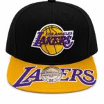 Black Lakers cap with a yellow brim and purple 'LAKERS' logo embroidered on the front panel and a white sticker on the brim.