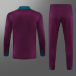 Back view of a purple tracksuit set (long-sleeve top and pants) with teal accents on the collar, cuffs, and pant hems.