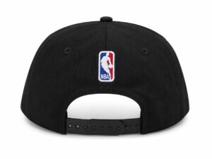 Back view of a black baseball cap with an adjustable strap and a small embroidered NBA logo in the center.