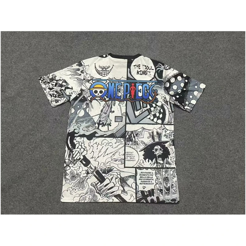 770a5abb440fd95b-1-800x800-1 | UAE SPORT STORE White manga-collage T-shirt featuring One Piece branding and comic panels, laid flat on a gray carpet.