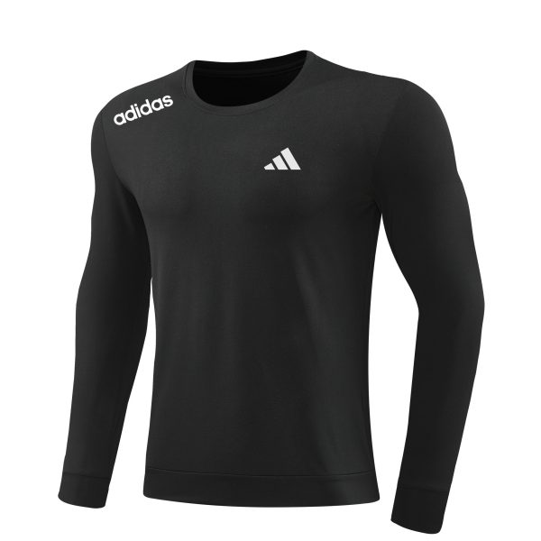 Black long-sleeve compression shirt with white Adidas branding on the left shoulder and center chest.