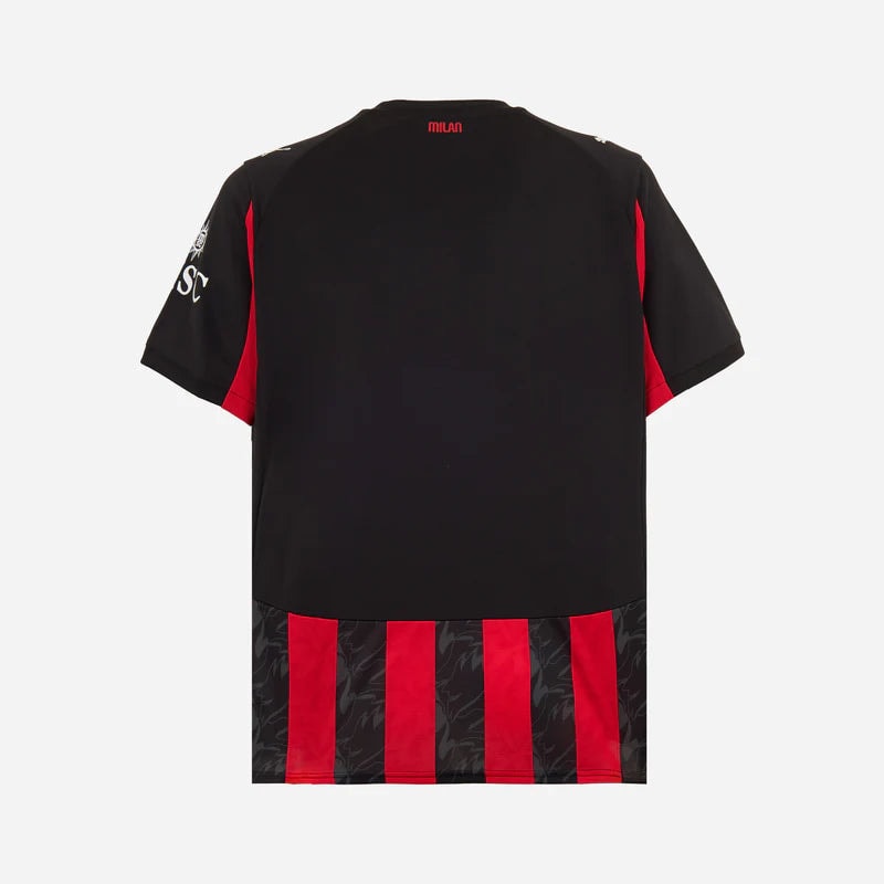 779962-A81_02_800x_97579019-0882-45cf-8939-b8fd34cd4039 | UAE SPORT STORE Back view of a black short-sleeve sports jersey with red side panels and a bottom stripe section featuring red and black vertical stripes with a subtle pattern at the hem.