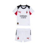 White soccer jersey with black collar and red sleeves, paired with white shorts featuring team crest and Emirates Fly Better sponsor.