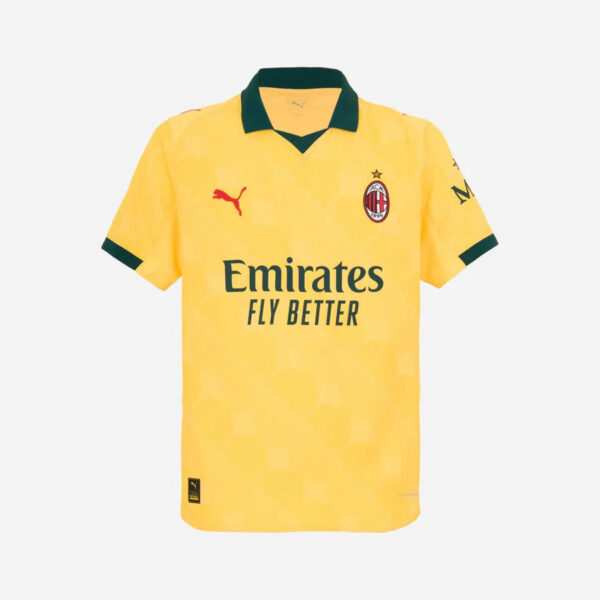 AC Milan yellow away jersey with green collar, Puma logo, club crest, and 'Emirates Fly Better' sponsor text