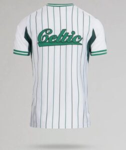 White Celtic football jersey with vertical green pinstripes seen from the back, featuring a green script logo across the mid-back.