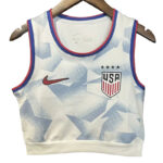 White USA basketball jersey with blue geometric pattern, Nike swoosh, and team crest on the chest, hanging on a wooden hanger.