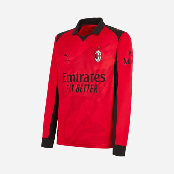 Red AC Milan football jersey with black shoulders and Emirates Fly Better sponsor.