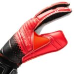 7B | UAE SPORT STORE Close-up of a red and black padded sports glove on a white background.