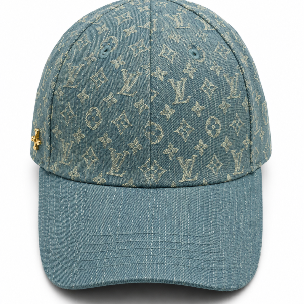 Denim baseball cap with a beige Louis Vuitton monogram pattern and a curved brim.