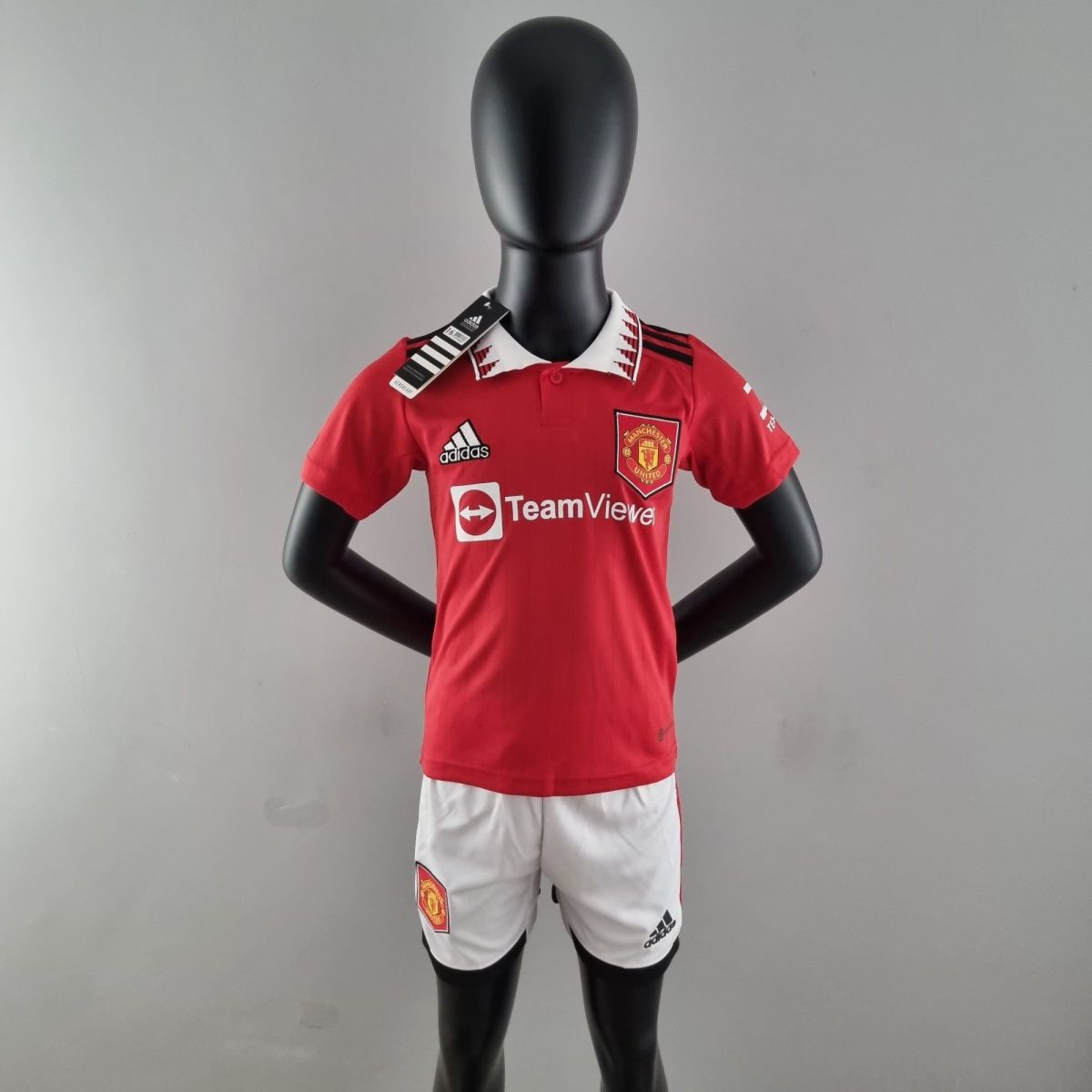 Mannequin wearing a red Manchester United football shirt with sponsor TeamViewer and Adidas logos.