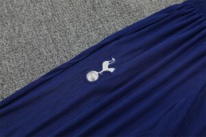 Blue fabric with Tottenham Hotspur crest featuring a white cockerel standing on a ball.