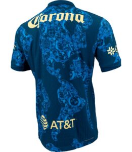 7btwf5ZGWnMZYfn | UAE SPORT STORE Blue athletic jersey shown from the back with a light-blue world-map pattern; AT&T sponsor logo near the lower back and repeating team crest graphics across the fabric.