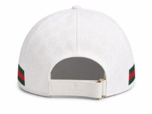 Back view of a white Gucci cap with an embossed GG monogram pattern and an adjustable strap closure at center.