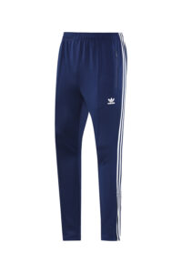 Navy blue Adidas track pants with white side stripes and a zippered side pocket, front view shown on a white background