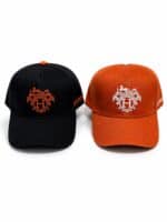 Heritage Crest Luxury Cap with embroidered logo in black and orange.