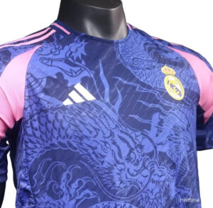 Blue Real Madrid football jersey with pink sleeves and dragon pattern, featuring Adidas logo and Real Madrid crest on chest on a display mannequin.